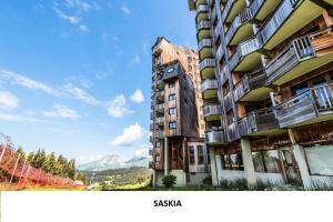 a building with balconies on the side of it at Résidence Quartier Falaise - maeva Home - Studio 4 personnes - Sélection 474 in Avoriaz
