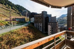 a balcony with a view of a city at Résidence Quartier Falaise - maeva Home - Appartement 2 pièces 7 personnes - Sélection MAE-9894 in Avoriaz