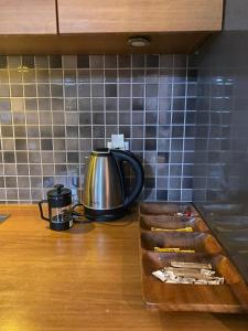 a tea kettle on a counter in a kitchen at D&D SUİTES in Istanbul