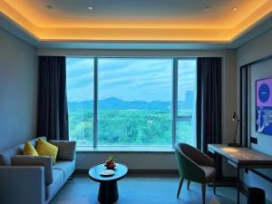 Un lugar para sentarse en Mustel Hotel Knowledge City Guangzhou