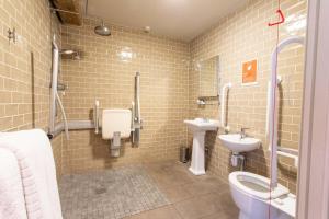 a bathroom with a toilet and a sink at 1777. At The Albion in Wimborne Minster