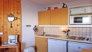 Kuchyň nebo kuchyňský kout v ubytování Résidence Parc Aux Etoiles - C201PAE - APPT T3 SPACIEUX - BALCON - 4/6 personnes MAE-8704