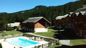 an aerial view of a resort with a swimming pool at Résidence Parc Aux Etoiles - Appartements pour 6 Personnes 794 in Narreyroux
