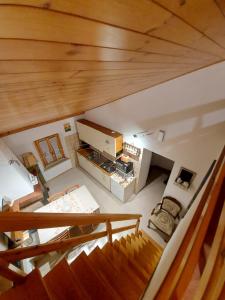 an overhead view of a living room with a wooden ceiling at Casa Lorenzo - nel centro storico di Fiumalbo in Fiumalbo