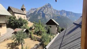 a view of a mountain from the roof of a building at Chalet - Chalets pour 13 Personnes 594 in Puy-Saint-Vincent