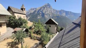 a view of a mountain from the roof of a building at Résidence Maison - Superbe Maison de Village entièrement rénovée MAE-5594 in Puy-Saint-Vincent