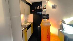 a small kitchen with a sink and a refrigerator at Résidence Les Dauphinnelles 3 - Agréable Appartement de montagne 4/6 pers MAE-0791 in Vallouise