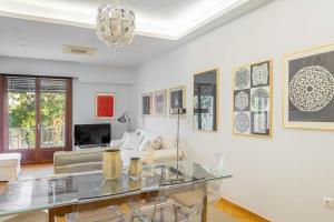 a living room with a glass table at Amazing location - 2 min from Acropolis in Athens