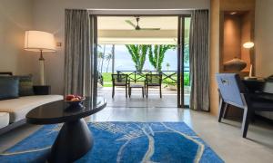 a living room with a couch and a table at Shangri-La Tanjung Aru, Kota Kinabalu in Kota Kinabalu