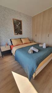 a bedroom with a large bed with towels on it at Anamor apartment 408 in Larnaka +38 photos