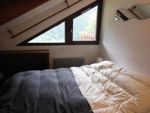 Uma cama ou camas num quarto em Résidence Campanule - Les Hauts De Planchamp - 3 Pièces pour 6 Personnes 193323