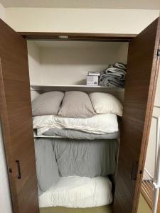 a room with two beds in a closet at ACT Residence No.1 in Tokyo