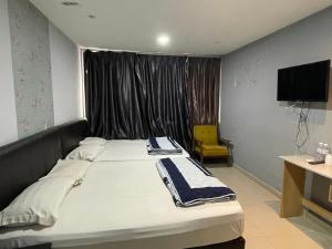 Postel nebo postele na pokoji v ubytování Hotel Rim Global Subang
