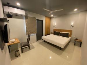 Ένα ή περισσότερα κρεβάτια σε δωμάτιο στο Angel Pink Vasundhara Sector 5 +15 φωτογραφίες