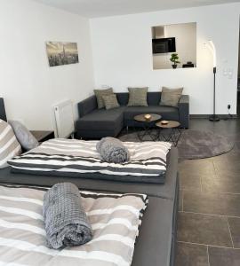 a living room with two beds and a couch at MY HOME N 35 in Villingen-Schwenningen