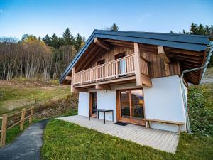 a tiny house with a balcony on a path at CHALET LUMI - Chalet CHALET MEIJE pour 6 Personnes 094 in Valmorel