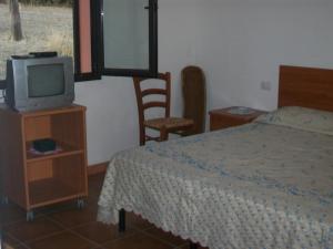 Postel nebo postele na pokoji v ubytování Agriturismo Farris Massimo