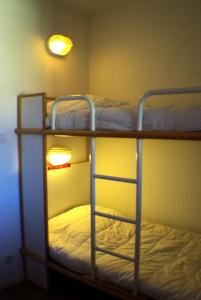 Krevet ili kreveti na kat u jedinici u objektu Résidence Le Hameau du Sauget - maeva Home - Appartement 2 pièces 4 person 604