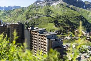 a group of buildings in front of a mountain at Résidence Arietis - Atria-Crozats - maeva Home - Appartement 3 pièces 7 pe 914 in Morzine