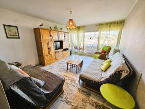 a living room with two beds and a couch at Au coeur du village,6 couchages in Saint-Mandrier-sur-Mer