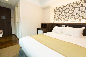 Postel nebo postele na pokoji v ubytování Shinagawa Tobu Hotel