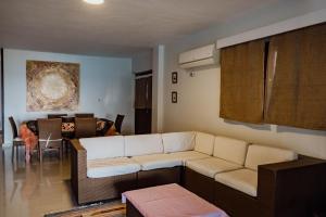 a living room with a white couch and a table at The Wind Farm in Dahab