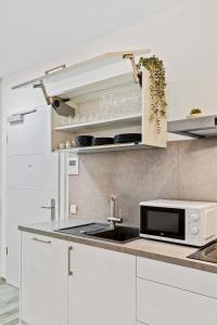 Kuchyň nebo kuchyňský kout v ubytování Elegant 1BR - Limpertsberg Gem
