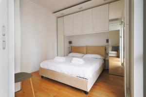 מיטה או מיטות בחדר ב-Bande Nere I Urban Spot