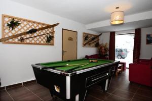 a living room with a pool table in it at Résidence Pra Sainte Marie - 2 Pièces pour 4 Personnes 164 in Vars