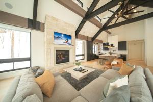 a living room with a couch and a fireplace at Wolf Rock Home 82 in Keystone