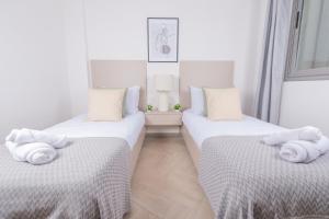 Splendide Apartments Au Golf tesisinde bir odada yatak veya yataklar