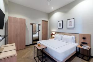 Hotel Blue Chip - My Downtown Hotels客房内的一张或多张床位