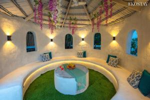 a room with a table in the middle of a building at Ekostay Luxe - CASA SIA - Ideal for Weddings - Poker Table in Lonavala