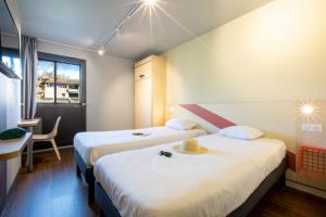 Postel nebo postele na pokoji v ubytování ibis budget Avignon Centre + 34 fotografií