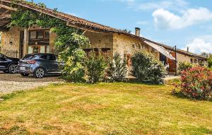 a car parked in front of a house at Beautiful Home In Armillac With House A Panoramic View in Armillac