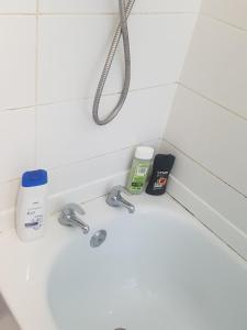 a bathroom counter with a sink and a shower at Double Room Close To Headingley Stadium Leeds in Leeds