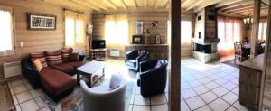 a living room filled with furniture and a fireplace at Chalet Granier - Chalets pour 6 Personnes 34 in Saint-Gervais-les-Bains