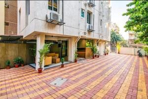 an empty courtyard in front of a building at ESTA EXPRESS,VIMAN NAGAR in Pune