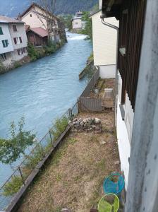 a view of a river from a house at Maison trois chambres in Schwändi