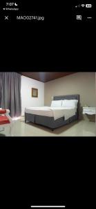 Postel nebo postele na pokoji v ubytování Hotel Suite Santa Rosa