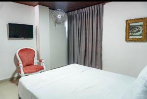 TV a/nebo společenská místnost v ubytování Hotel Suite Santa Rosa