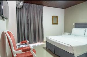 Postel nebo postele na pokoji v ubytování Hotel Suite Santa Rosa