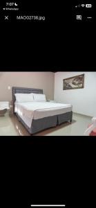 Postel nebo postele na pokoji v ubytování Hotel Suite Santa Rosa