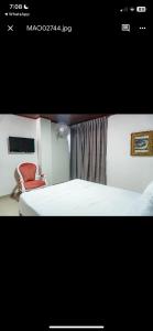 Postel nebo postele na pokoji v ubytování Hotel Suite Santa Rosa