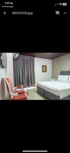 Postel nebo postele na pokoji v ubytování Hotel Suite Santa Rosa