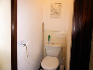 a small bathroom with a white toilet in a room at Résidence Le Brulaz - Studio pour 5 Personnes 50 in Les Contamines-Montjoie
