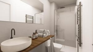a white bathroom with a sink and a toilet at Style Madrid Center Santiago Bernabeu in Madrid