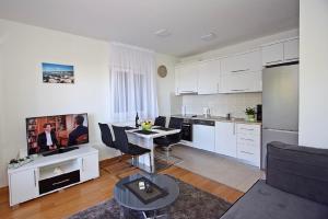 Kuchyň nebo kuchyňský kout v ubytování Apartman BartuLina + 22 fotografií