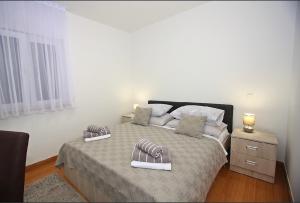 Postel nebo postele na pokoji v ubytování Apartman BartuLina