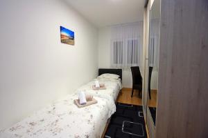 Postel nebo postele na pokoji v ubytování Apartman BartuLina